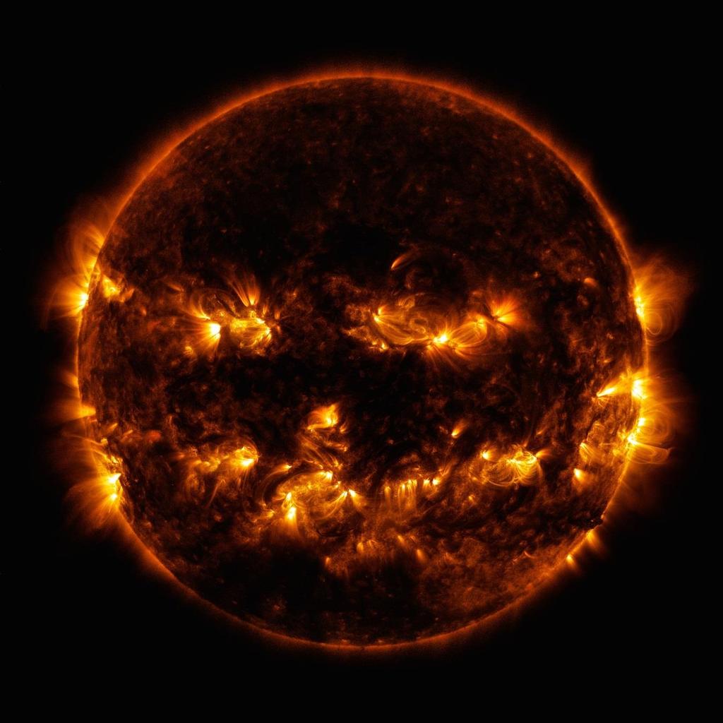 30 Jack O Lantern Sun NASA Solar Dynamics Observatory image. Active regions on the sun combined to look something like a jack-o-lantern s face on Oct. 8, 2014.