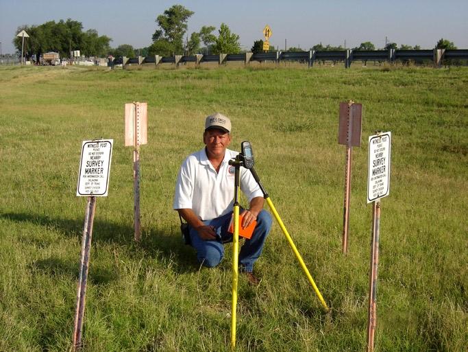 Left: Paulk gathers position information on known point. Below: City of Lawton surveyor Michael Porter locates a new hydrant.