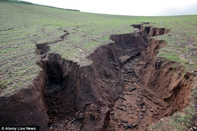 Gully erosion occurs when water is channelled across unprotected land and washes away the soil along the drainage lines.