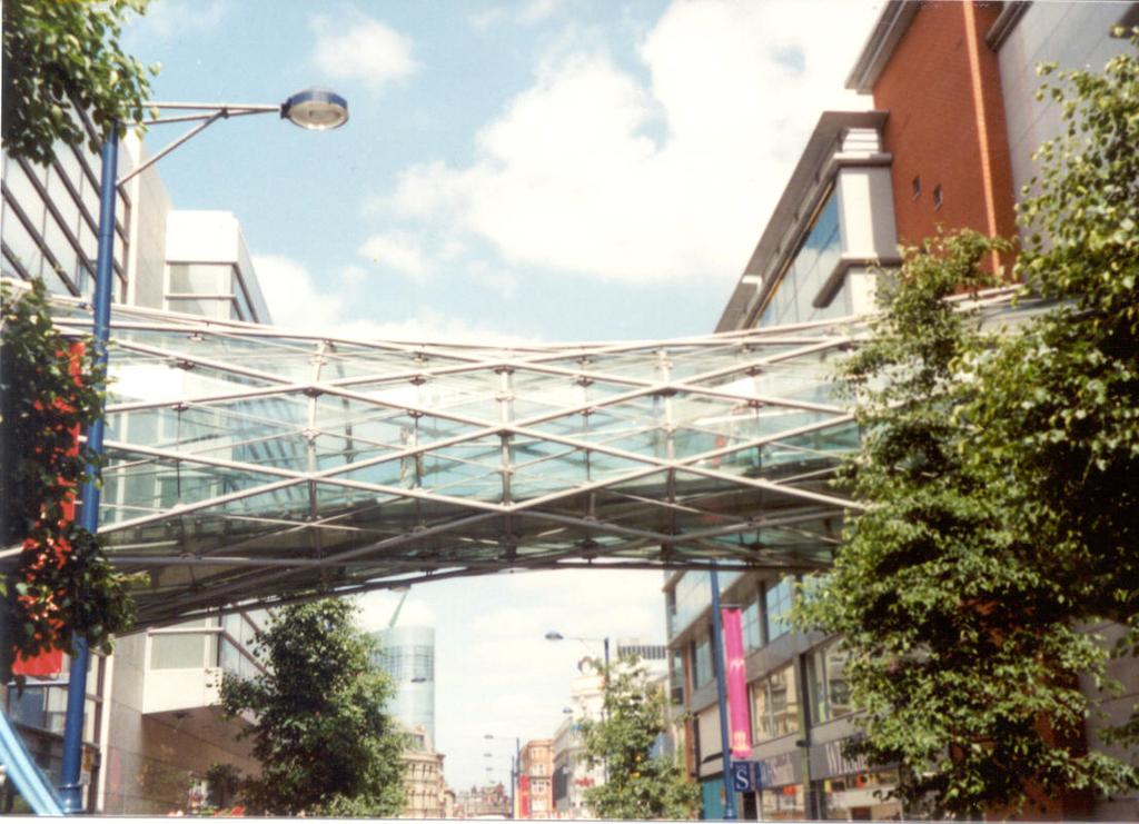 The two pictures below show real life applications of the lines on the hyperboloid, the bridge across Corporation Street between the Arndale Centre and Marks&Spencer and statues in Manlleu, Catalonia.