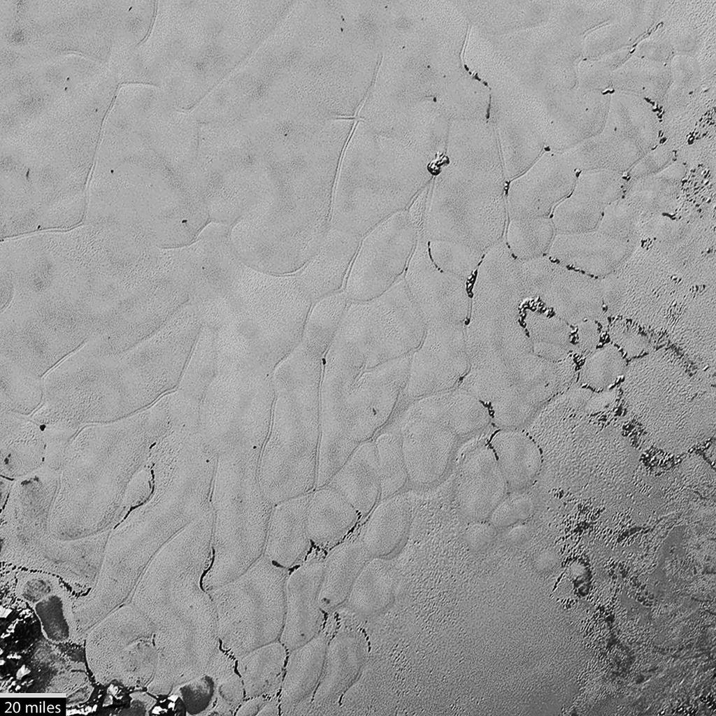 ones (C) It allows us to determine the mass and density of Eris (D) It allows a better determination of the orbit of Eris around the Sun 67. This image shows mottled terrain on Pluto.