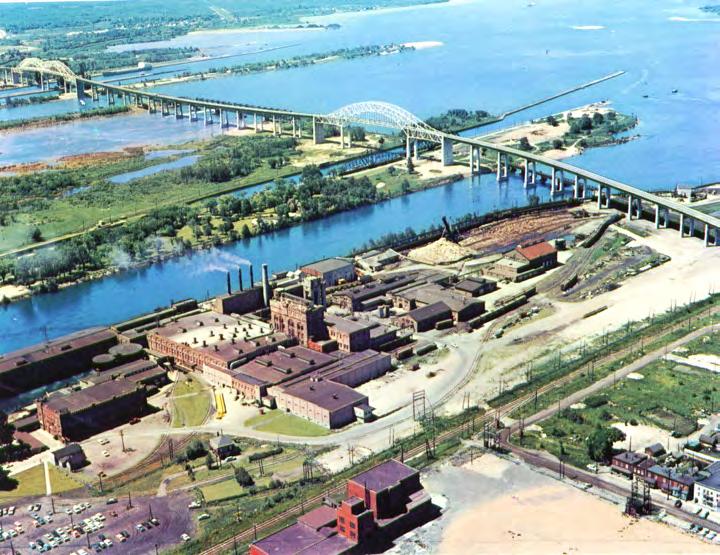 Photo 136. Locks on the St. Marys River, Sault Ste. Marie, looking towards Lake Superior. gical feature in the vicinity of Sault Ste. Marie. A rugged highland, with elevations of 400 to 600 feet above Lake Superior, the batholith separates the St.