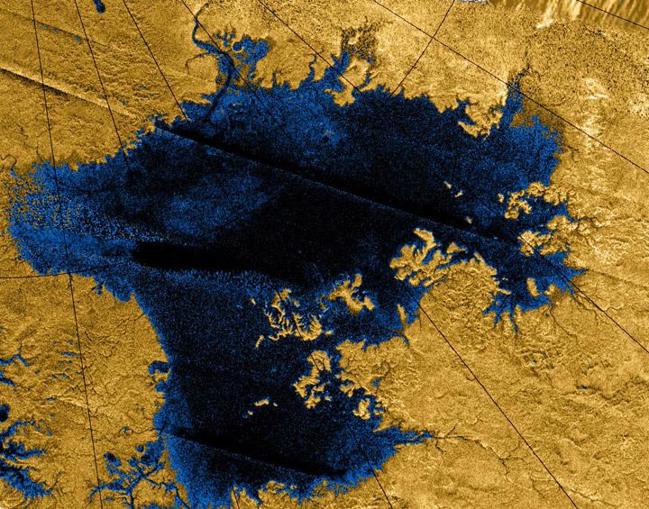 surface of Titan looks like: a fairly flat surface with hydrocarbon