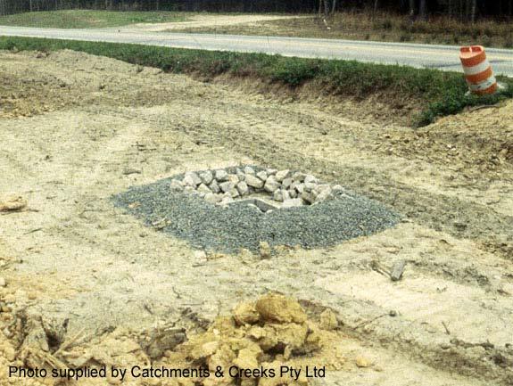 Symbol Photo 1 Rock and aggregate drop inlet protection located with dual carriageway Photo 2 Rock and aggregate drop inlet protection Key Principles 1.