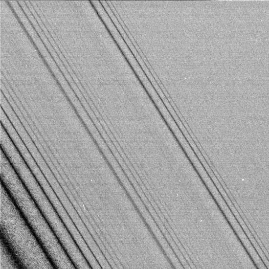 Spiral density waves in Saturn s A ring Each set of waves is driven by Mimas (probably)