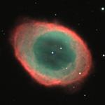 This remnant of a dead star looks exactly as it's name says a ring or doughnut shape cloud of gas. The nebula is about 2.