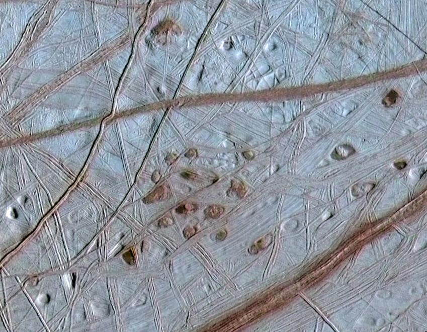 Europa s Surface Dark spots (lenticulae = freckles) are possible evidence