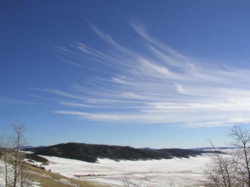 Cirrus Cirrus clouds are made of ice crystals and look like long, thin, wispy white streamers high in the sky.
