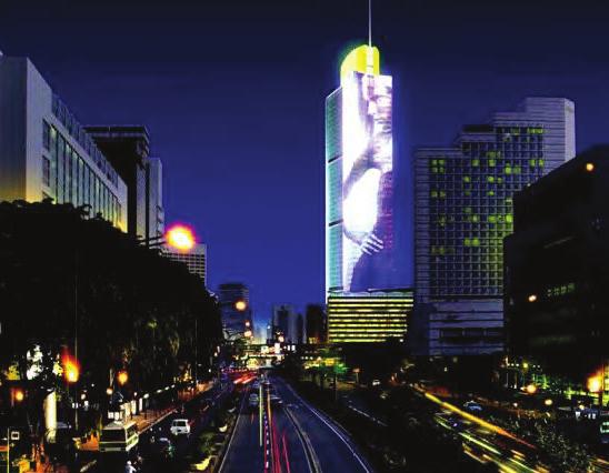 LED screens depicting both art and advertisements along opposite curtain wall facades