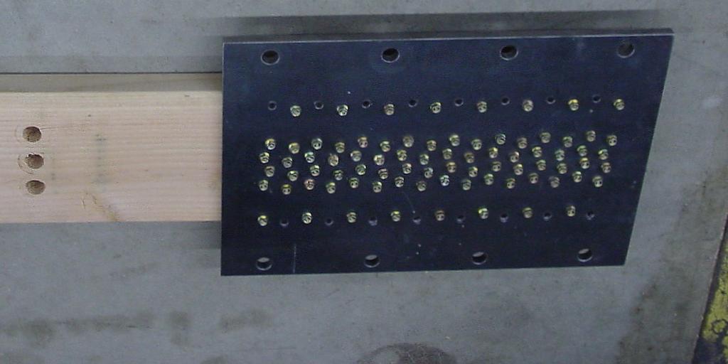 All wood members were attached to 12.7 mm (½ in.) steel side plates with predrilled holes with an adequate number of 6.4 mm (¼ in.