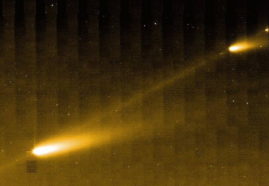The cometary (or asteroidal) dust density is always greatest around the parent body itself, so whenever it enters the inner solar system and the Earth passes near to it, there's a chance for a meteor