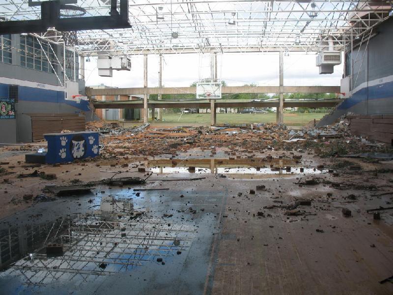 The next photo (below) shows the inside of Childress (TX) High School gym after a May 2006 tornado. The tornado was rated F1 (weak, on the original F-scale) at the school.