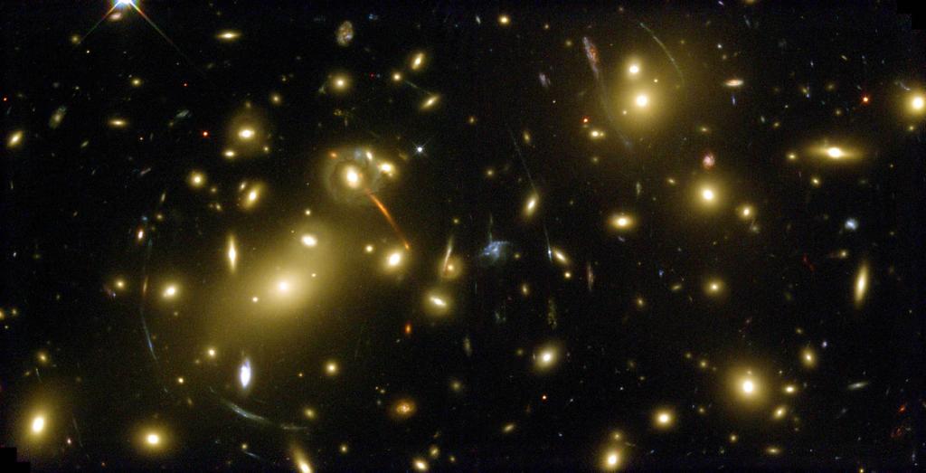 Gravitational lensing by clusters of galaxies One can model the amount and distribution of