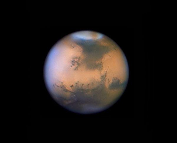 This photograph of Mars was taken from Earth in 2010 using the 1-meter telescope at the Pic du Midi Observatory.
