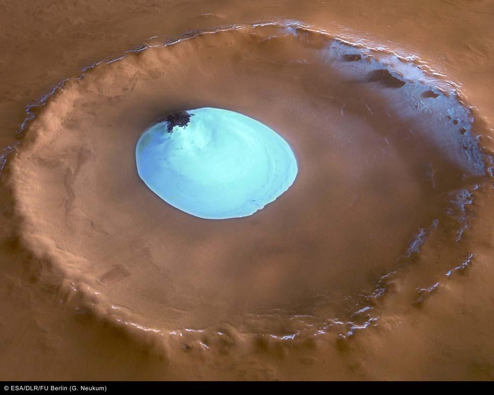 A solid sheet of water ice lies at the bottom of a crater near the North Pole of Mars. The robotic Mars Express spacecraft took the above image in early February.