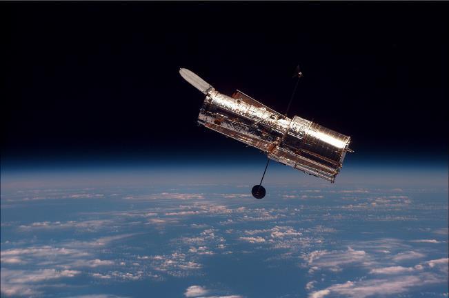 How big is the universe? This is the most powerful telescope ever made, the Hubble. It is like a giant camera that floats above Earth. Question Do you know what this is or what it does?