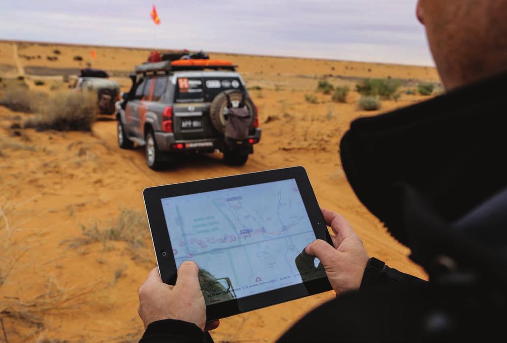 A Map Patrol team member captures a waypoint with the HemaExplorer app during an expedition through the Simpson Desert.