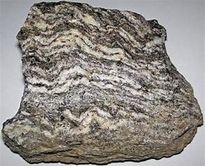 Metamorphic Rock Forms under extreme heat and pressure.