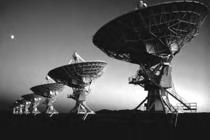 (b) This photograph shows a line of radio telescopes.