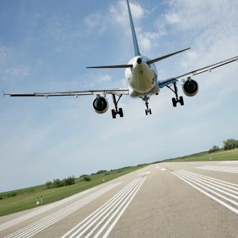 Example 2: Suppose the same plane reaches its destination and touches down on the runway travelling at 305 km/h