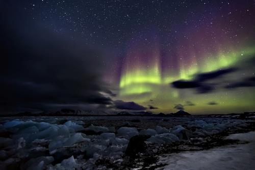 Generally, an auroral display features a variety of red, green and blue lights, which