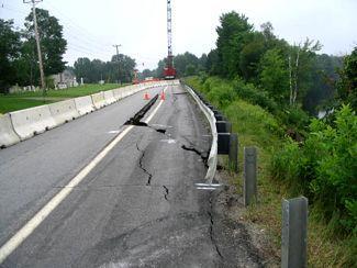 Photo by Michael E. Foley Greenbush Landslide Features The next photos show the three (3) main parts of the Greenbush landslide: Tension or crown cracks along the edge of the roadway (Figures 8-9).