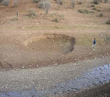 SINKHOLES At the contact of Amiran and Tal-e-zang (some authors believe it as Tarbur formation) several sinkholes (ponors) with