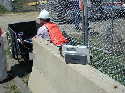 Ambient air was sampled by placing the znose on top of a 3 foot high concrete wall facing into the site. Figure 18- Downwind location (arrow) near active excavation of contaminated soil.