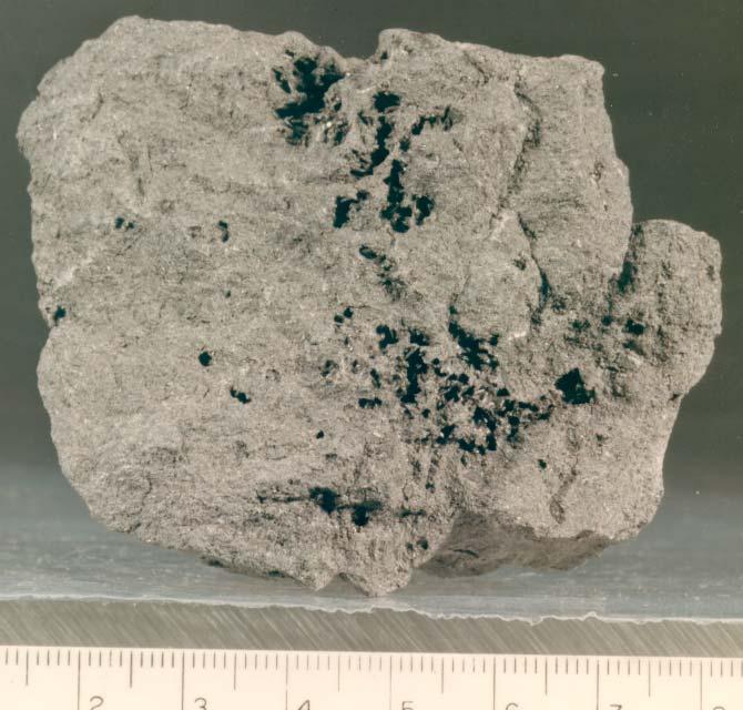 Figure 9: Photo of broken surface of 12052,1 showing pyroxene crystals in vugs. NASA #S70-44847. Scale 1 cm.